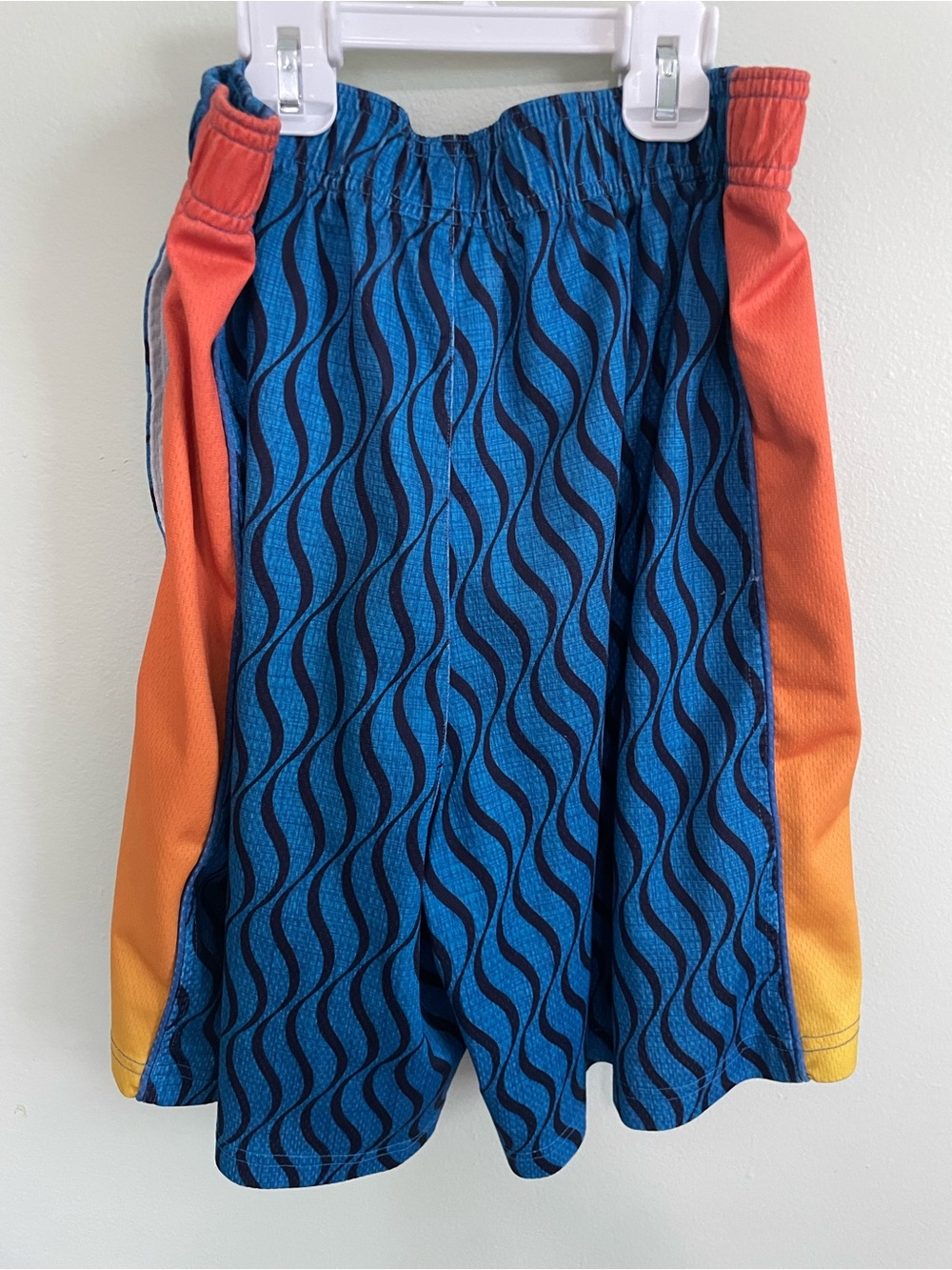 Men's Blue Wave Athletic Lacrosse Shorts with Orange Gradient Sides - Picture 6 of 7